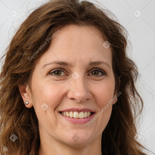 Joyful white adult female with long  brown hair and brown eyes