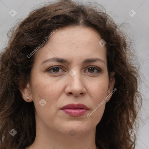 Joyful white adult female with long  brown hair and brown eyes