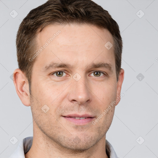 Joyful white adult male with short  brown hair and grey eyes