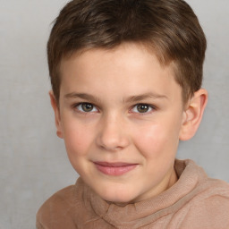 Joyful white child male with short  brown hair and brown eyes