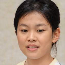 Joyful white child female with medium  brown hair and brown eyes