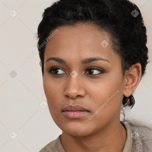 Neutral black young-adult female with short  black hair and brown eyes