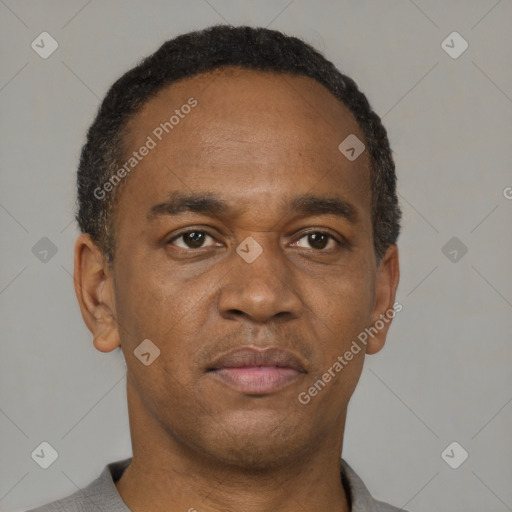 Neutral latino young-adult male with short  brown hair and brown eyes