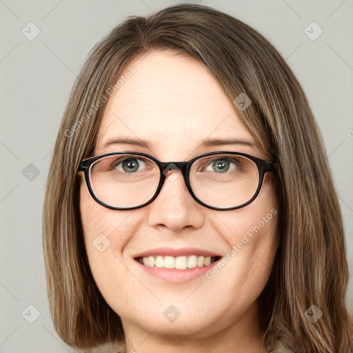 Joyful white young-adult female with long  brown hair and green eyes