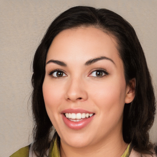 Joyful white young-adult female with medium  black hair and brown eyes