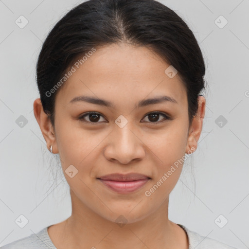 Joyful latino young-adult female with short  brown hair and brown eyes