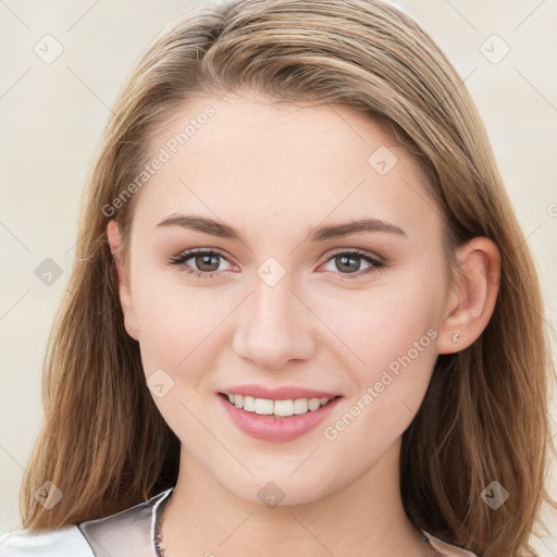 Joyful white young-adult female with long  brown hair and blue eyes