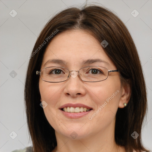 Joyful white adult female with medium  brown hair and brown eyes