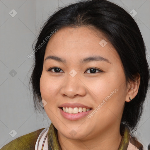 Joyful asian young-adult female with medium  brown hair and brown eyes