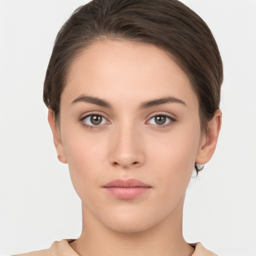 Neutral white young-adult female with short  brown hair and brown eyes