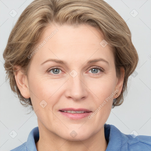 Joyful white adult female with medium  brown hair and blue eyes