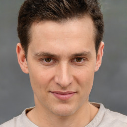 Joyful white adult male with short  brown hair and brown eyes