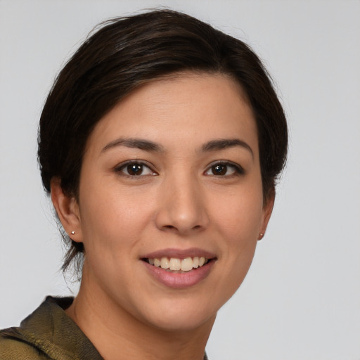 Joyful white young-adult female with medium  brown hair and brown eyes