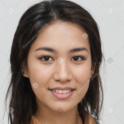 Joyful latino young-adult female with long  brown hair and brown eyes