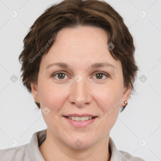 Joyful white adult female with short  brown hair and brown eyes