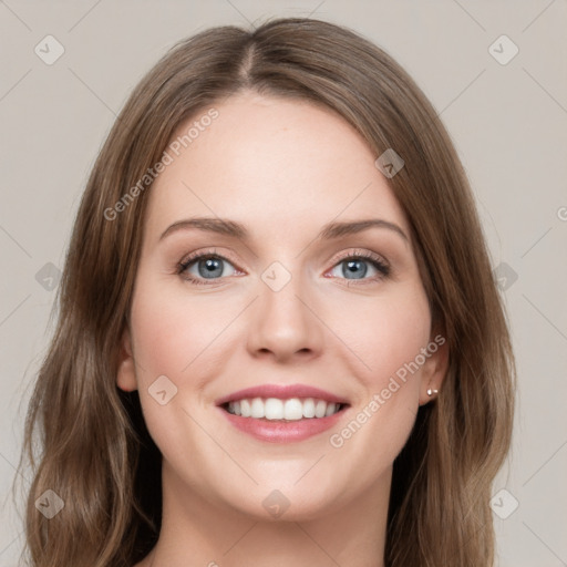 Joyful white young-adult female with medium  brown hair and green eyes