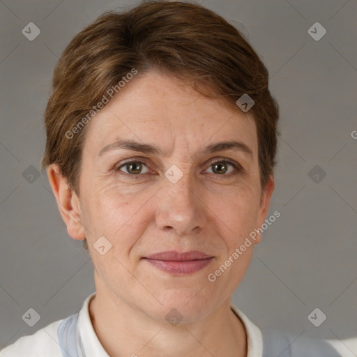 Joyful white adult female with short  brown hair and grey eyes