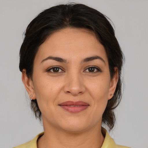 Joyful asian young-adult female with medium  brown hair and brown eyes
