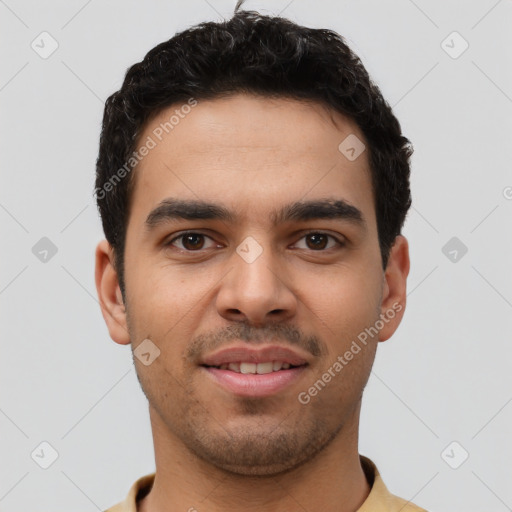 Joyful latino young-adult male with short  brown hair and brown eyes