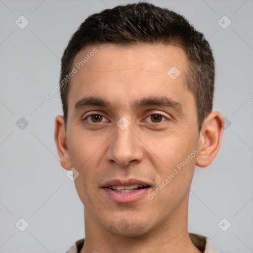 Joyful white young-adult male with short  brown hair and brown eyes