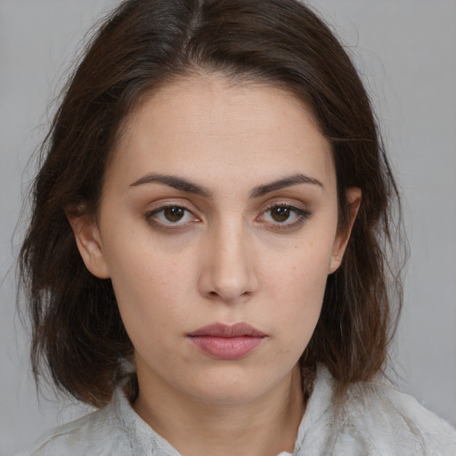 Neutral white young-adult female with medium  brown hair and brown eyes