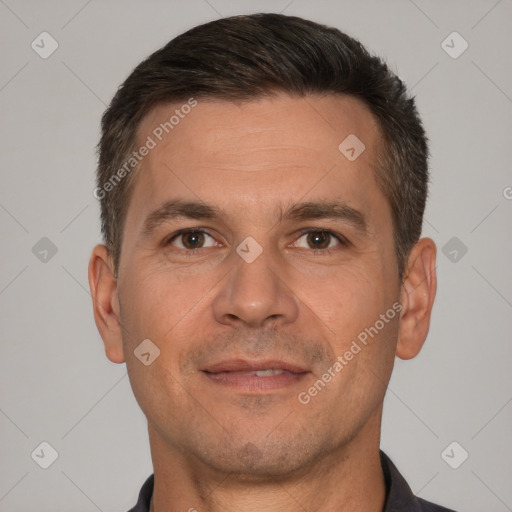 Joyful white adult male with short  brown hair and brown eyes