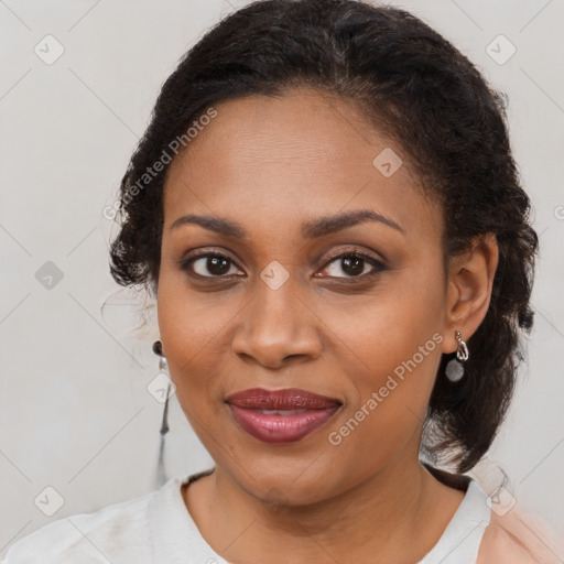 Joyful black young-adult female with medium  brown hair and brown eyes