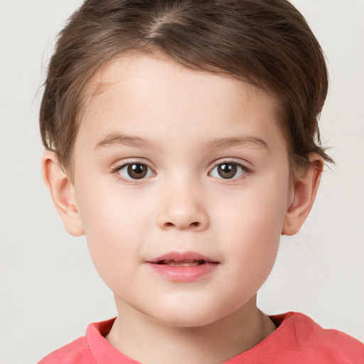 Joyful white child male with short  brown hair and brown eyes