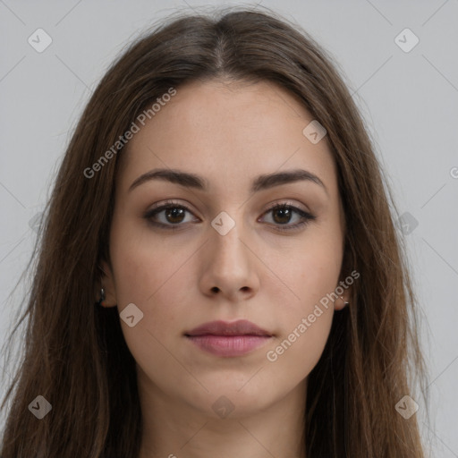 Neutral white young-adult female with long  brown hair and brown eyes