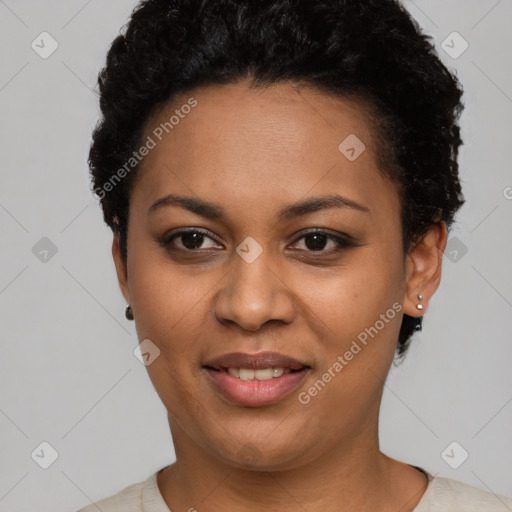 Joyful black young-adult female with short  black hair and brown eyes