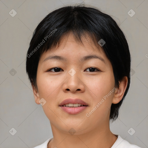 Joyful asian young-adult female with short  brown hair and brown eyes