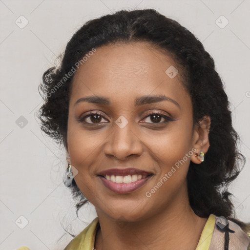 Joyful black young-adult female with long  black hair and brown eyes