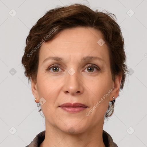 Joyful white adult female with short  brown hair and grey eyes