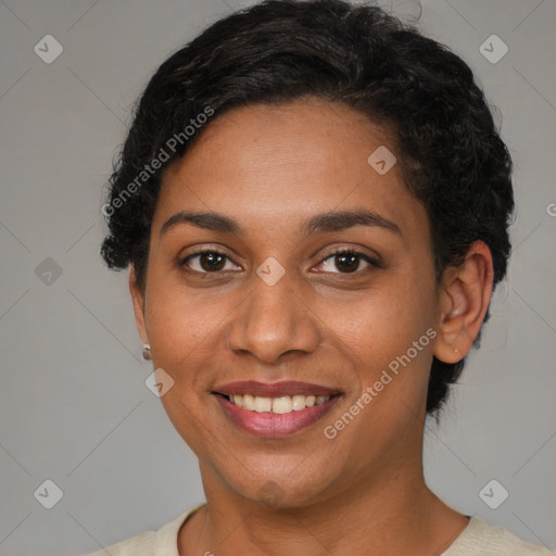 Joyful latino young-adult female with short  brown hair and brown eyes