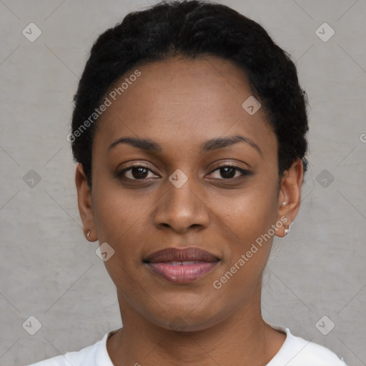 Joyful black young-adult female with short  black hair and brown eyes