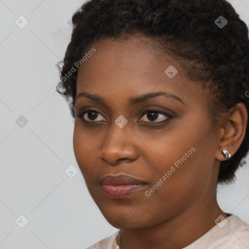 Neutral black young-adult female with medium  brown hair and brown eyes