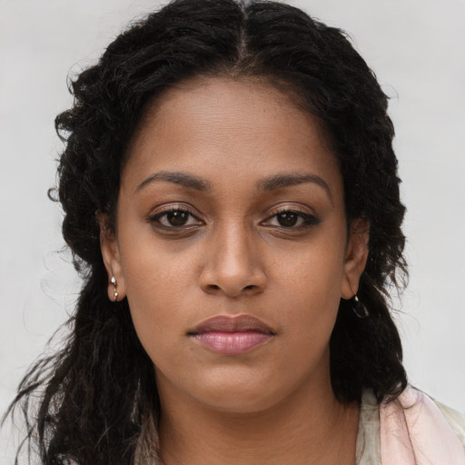 Neutral black young-adult female with long  brown hair and brown eyes