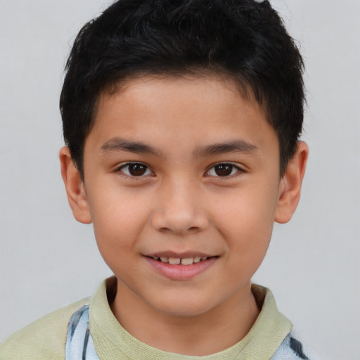 Joyful white child male with short  brown hair and brown eyes