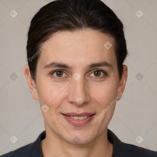 Joyful white adult female with short  brown hair and brown eyes