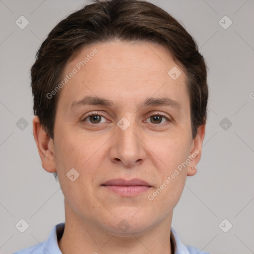 Joyful white adult male with short  brown hair and brown eyes