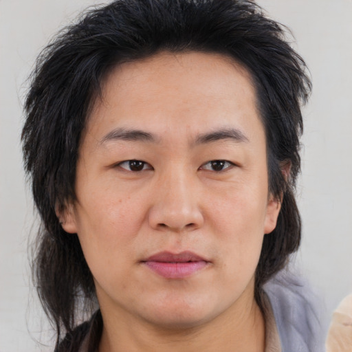Neutral asian adult male with medium  brown hair and brown eyes
