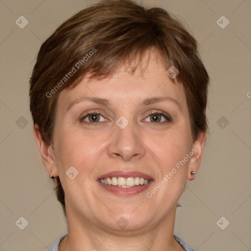 Joyful white adult female with short  brown hair and grey eyes