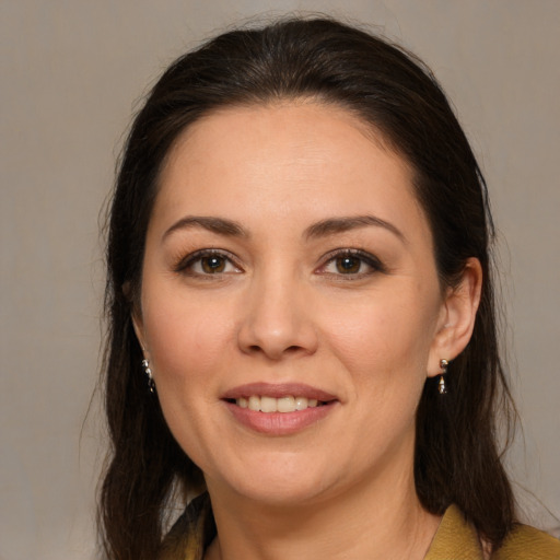 Joyful white young-adult female with medium  brown hair and brown eyes