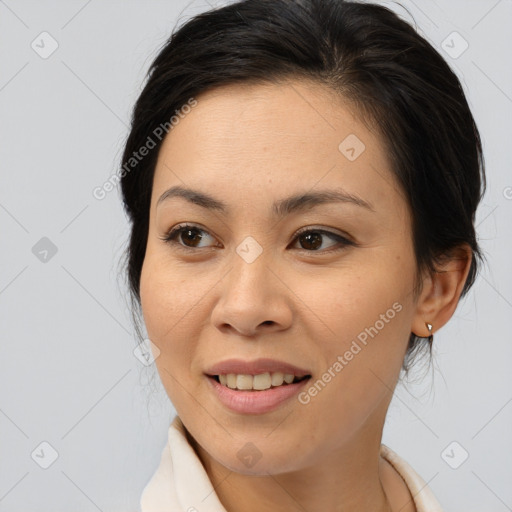 Joyful asian young-adult female with medium  brown hair and brown eyes