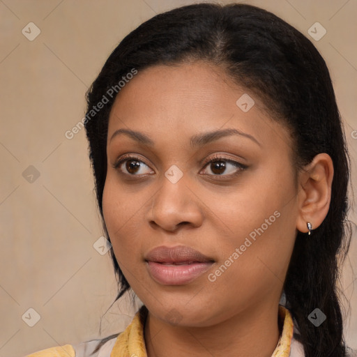 Joyful black young-adult female with long  brown hair and brown eyes