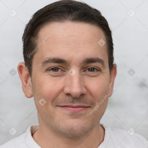 Joyful white adult male with short  brown hair and brown eyes