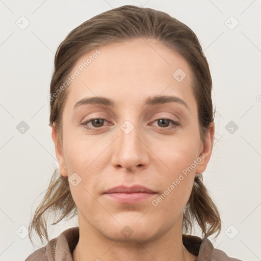 Joyful white young-adult female with medium  brown hair and grey eyes