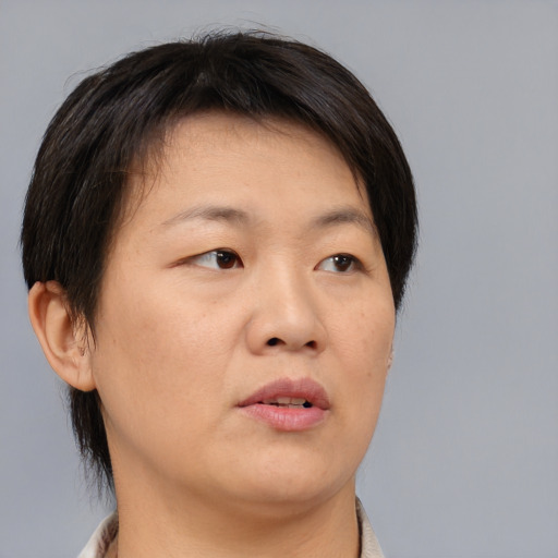 Neutral asian young-adult female with short  brown hair and brown eyes