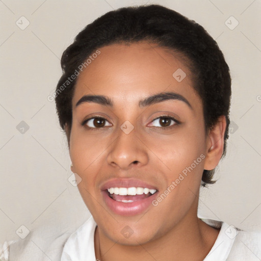 Joyful latino young-adult female with short  black hair and brown eyes