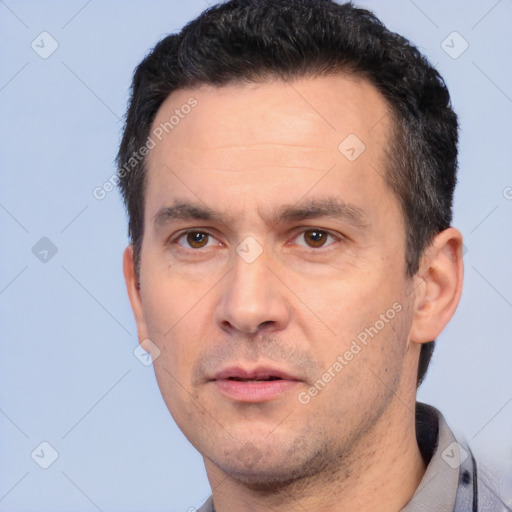 Neutral white adult male with short  black hair and brown eyes